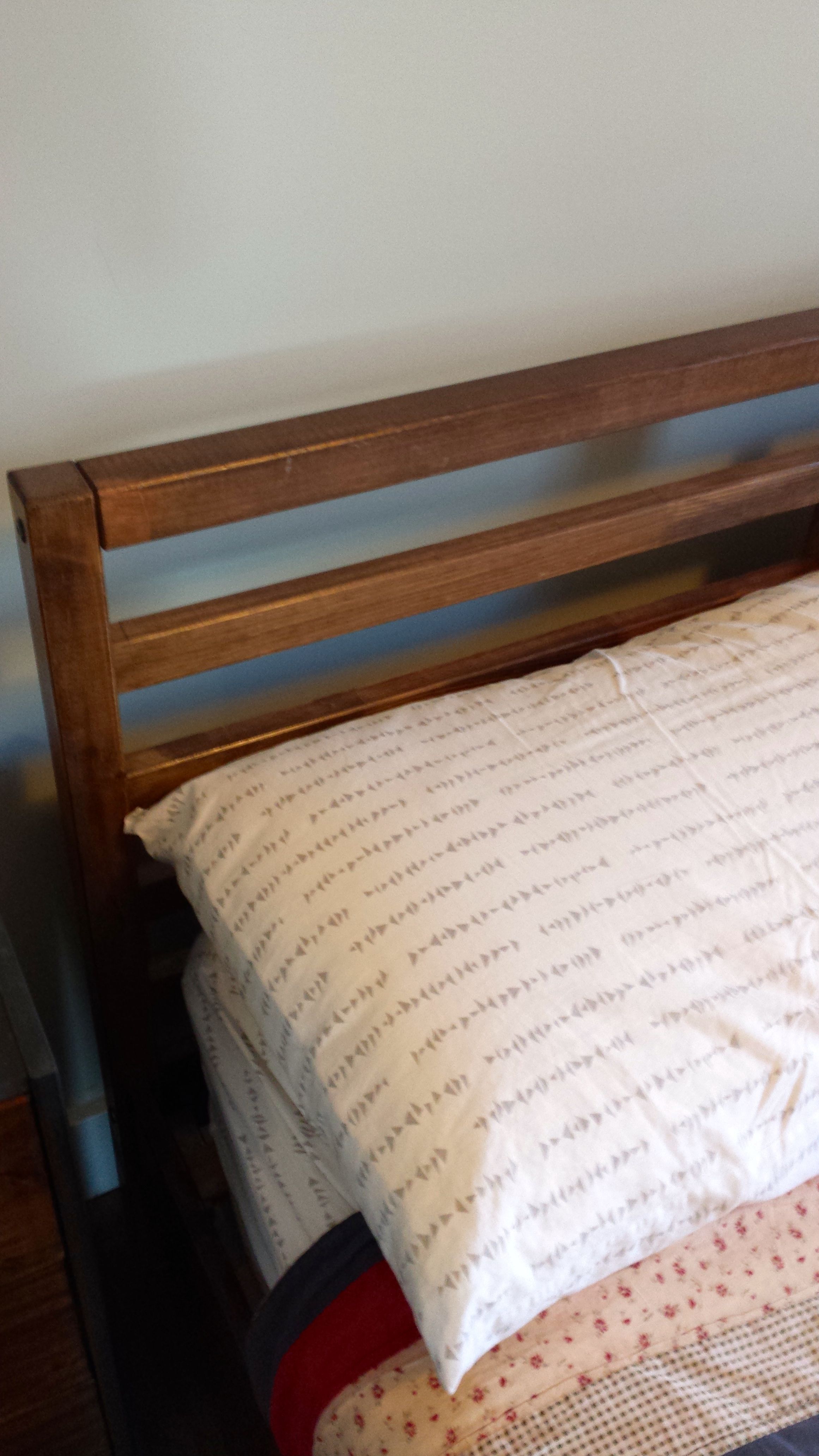 Finished stained pine bed frame DIY project